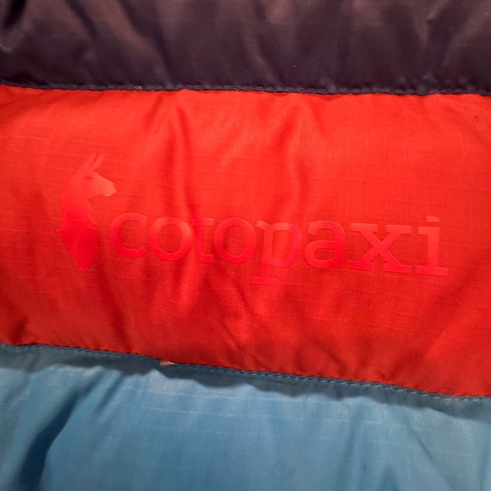 Cotopaxi Woman’s Puffer Jacket in Blue with Orange and Light Blue Accents - Picture 5 of 5